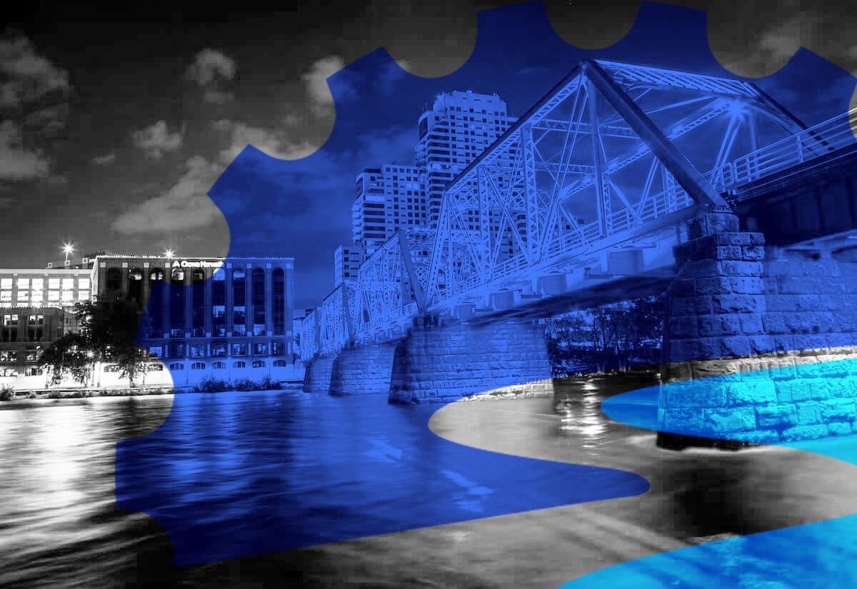 Grand Rapids riverfront framed by the Grand River Makerspace gear